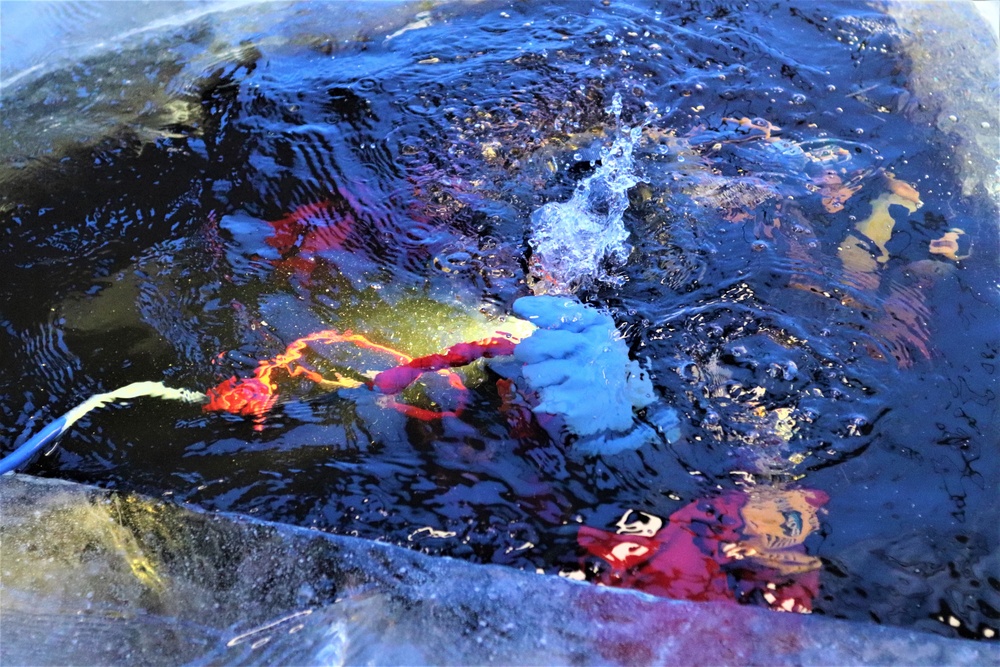 Fort McCoy firefighters practice diving under ice for rescue operations