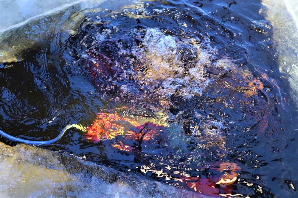 Fort McCoy firefighters practice diving under ice for rescue operations