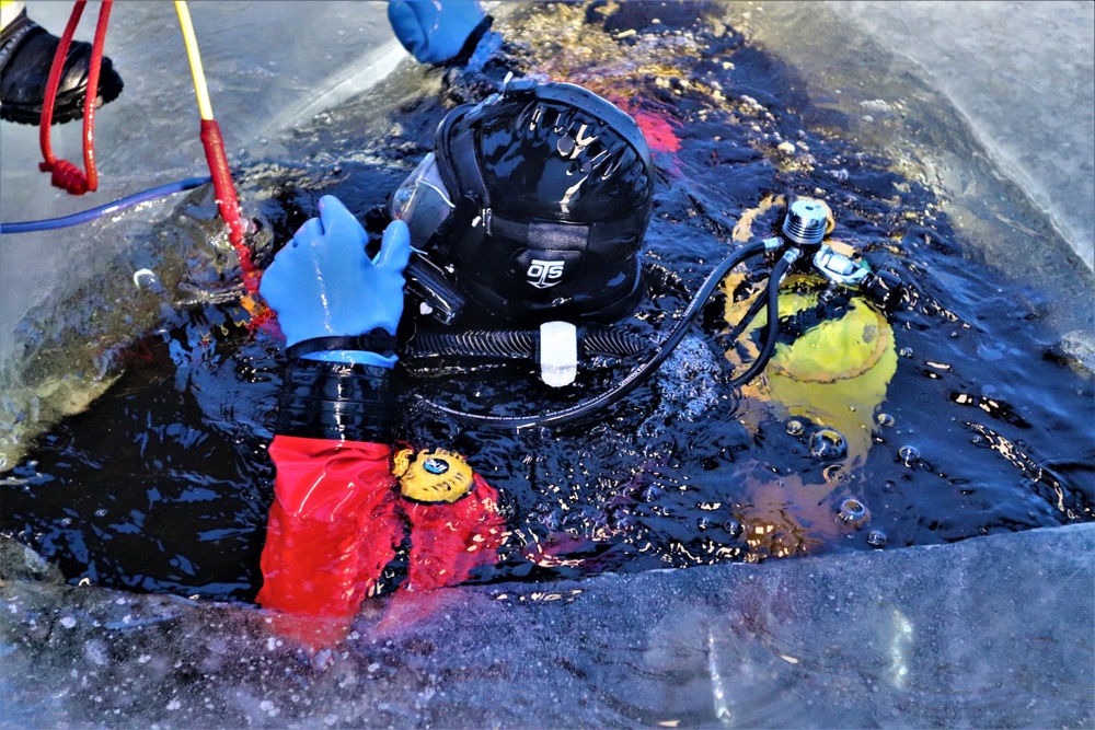 Fort McCoy firefighters practice diving under ice for rescue operations