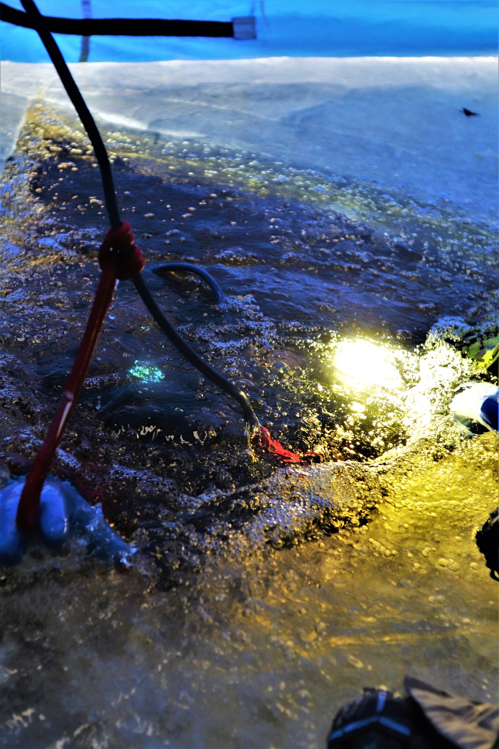 Fort McCoy firefighters practice diving under ice for rescue operations
