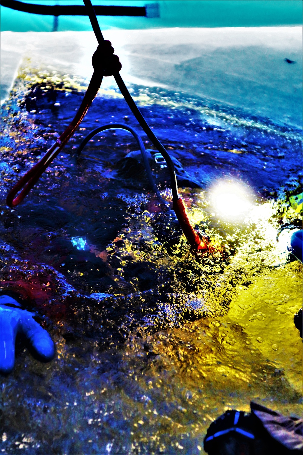 Fort McCoy firefighters practice diving under ice for rescue operations