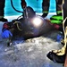 Fort McCoy firefighters practice diving under ice for rescue operations