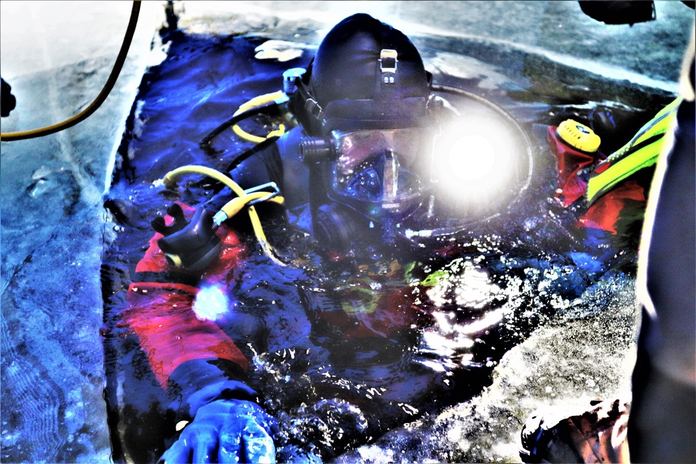 Fort McCoy firefighters practice diving under ice for rescue operations