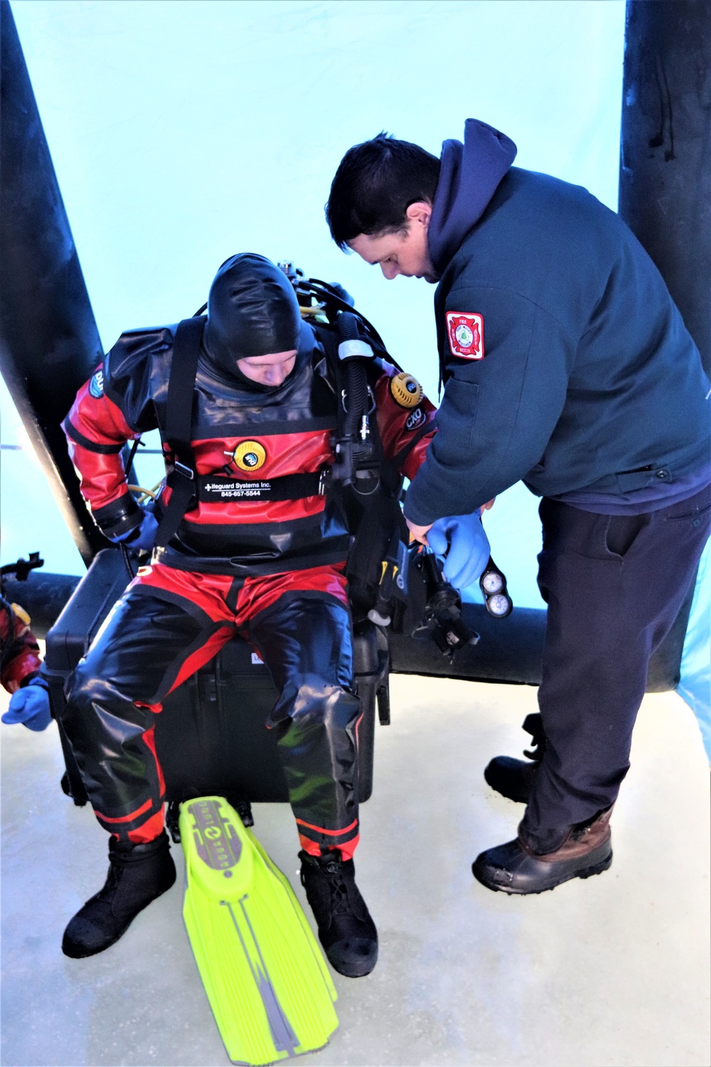 Fort McCoy firefighters practice diving under ice for rescue operations