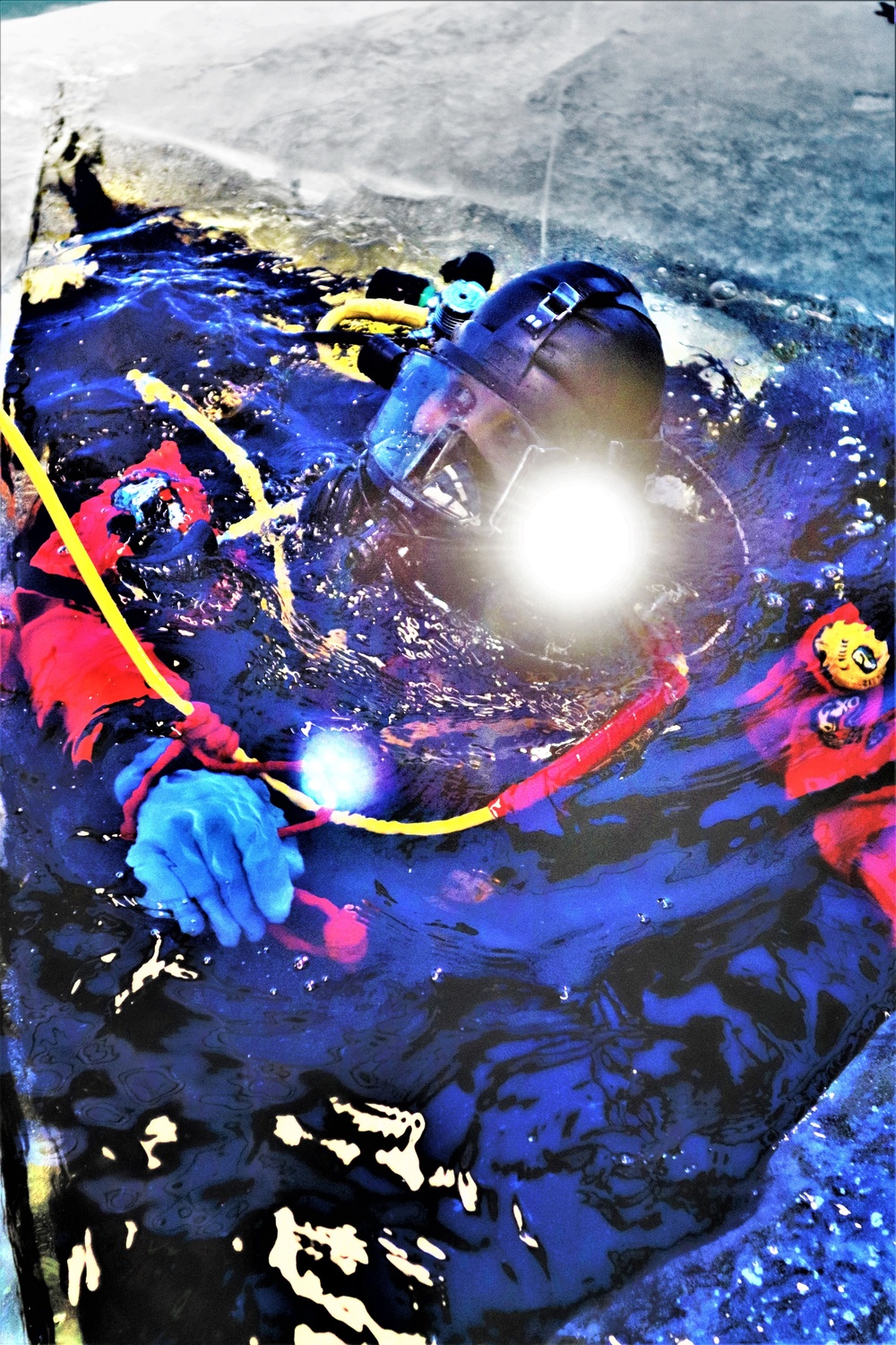 Fort McCoy firefighters practice diving under ice for rescue operations