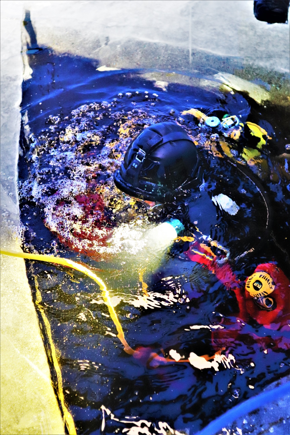 Fort McCoy firefighters practice diving under ice for rescue operations