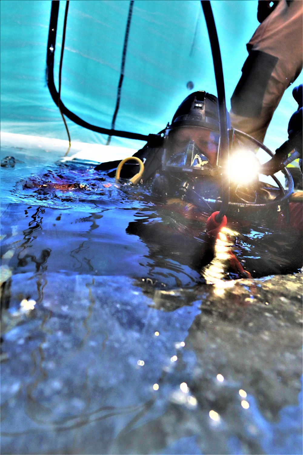 Fort McCoy firefighters practice diving under ice for rescue operations