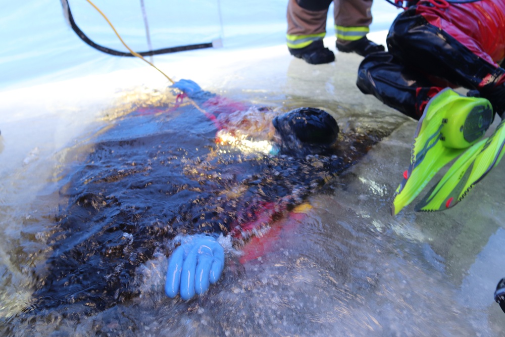 Fort McCoy firefighters practice diving under ice for rescue operations