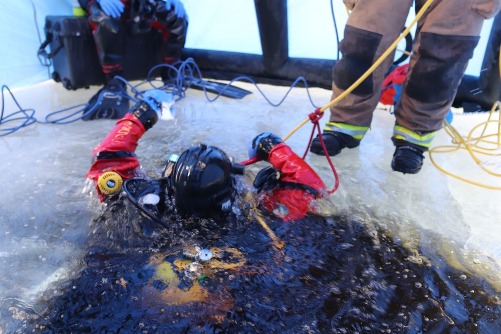 Fort McCoy firefighters practice diving under ice for rescue operations