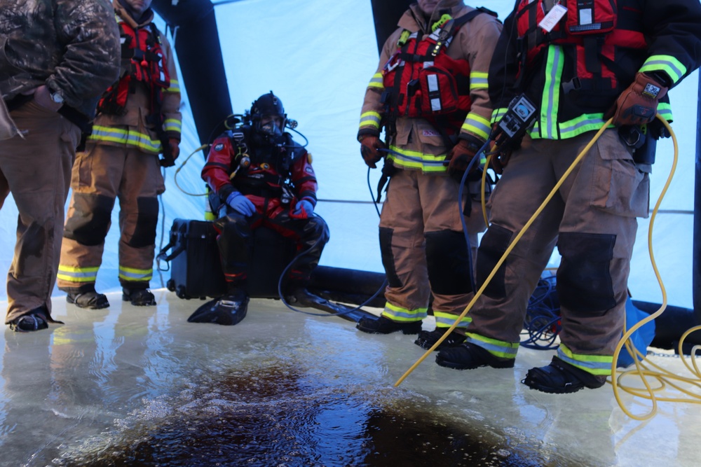 Fort McCoy firefighters practice diving under ice for rescue operations