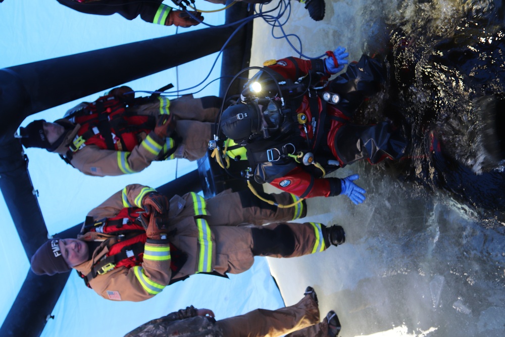 Fort McCoy firefighters practice diving under ice for rescue operations