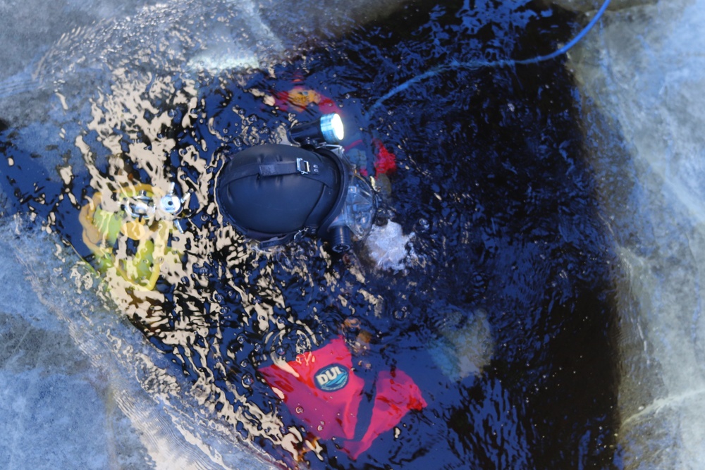 Fort McCoy firefighters practice diving under ice for rescue operations