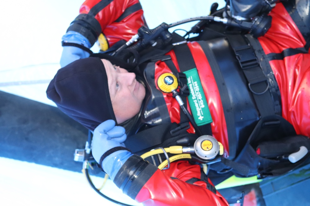 Fort McCoy firefighters practice diving under ice for rescue operations