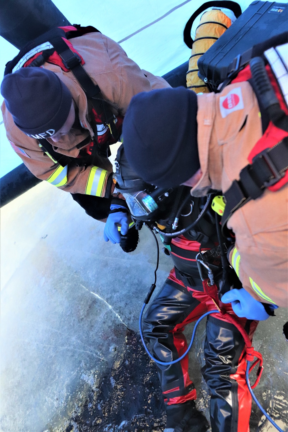 Fort McCoy firefighters practice diving under ice for rescue operations