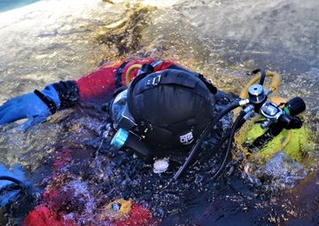 Fort McCoy firefighters practice diving under ice for rescue operations