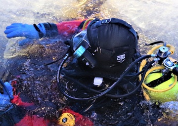 Fort McCoy firefighters practice diving under ice for rescue operations