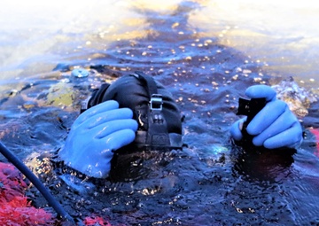 Fort McCoy firefighters practice diving under ice for rescue operations