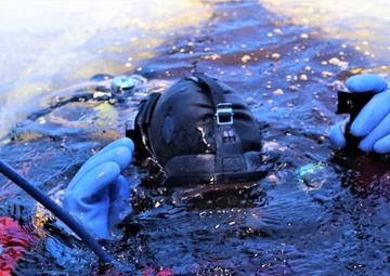 Fort McCoy firefighters practice diving under ice for rescue operations