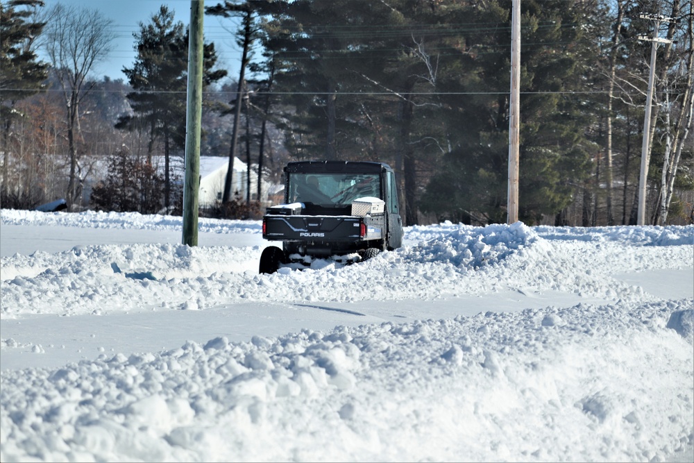 Contractors clear snow at Fort McCoy after February snowfall