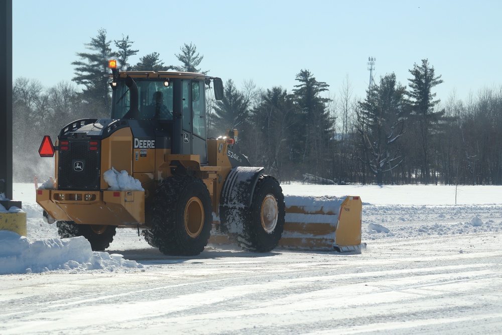 Contractors clear snow at Fort McCoy after February snowfall