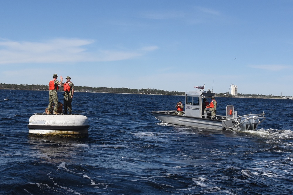 Boatswain's Mate 1st Class Taylor Baxley Reenlists atop mooring bouy