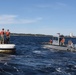 Boatswain's Mate 1st Class Taylor Baxley Reenlists atop mooring bouy