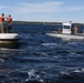 Boatswain's Mate 1st Class Taylor Baxley reenlists atop mooring bouy