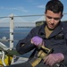 Sailors Perform Maintainance Aboard Charleston