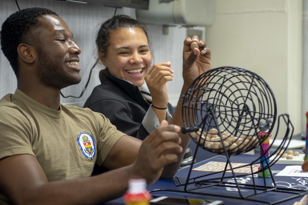 U.S. Sailors call out numbers during bingo night aboard the guided-missile destroyer USS Preble (DDG 88) in the Pacific Ocean, Feb. 16, 2019.