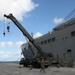 Naval Mobile Construction Battalion (NMCB) 133 det. Guam’s crane crew conduct a turnover crane lift