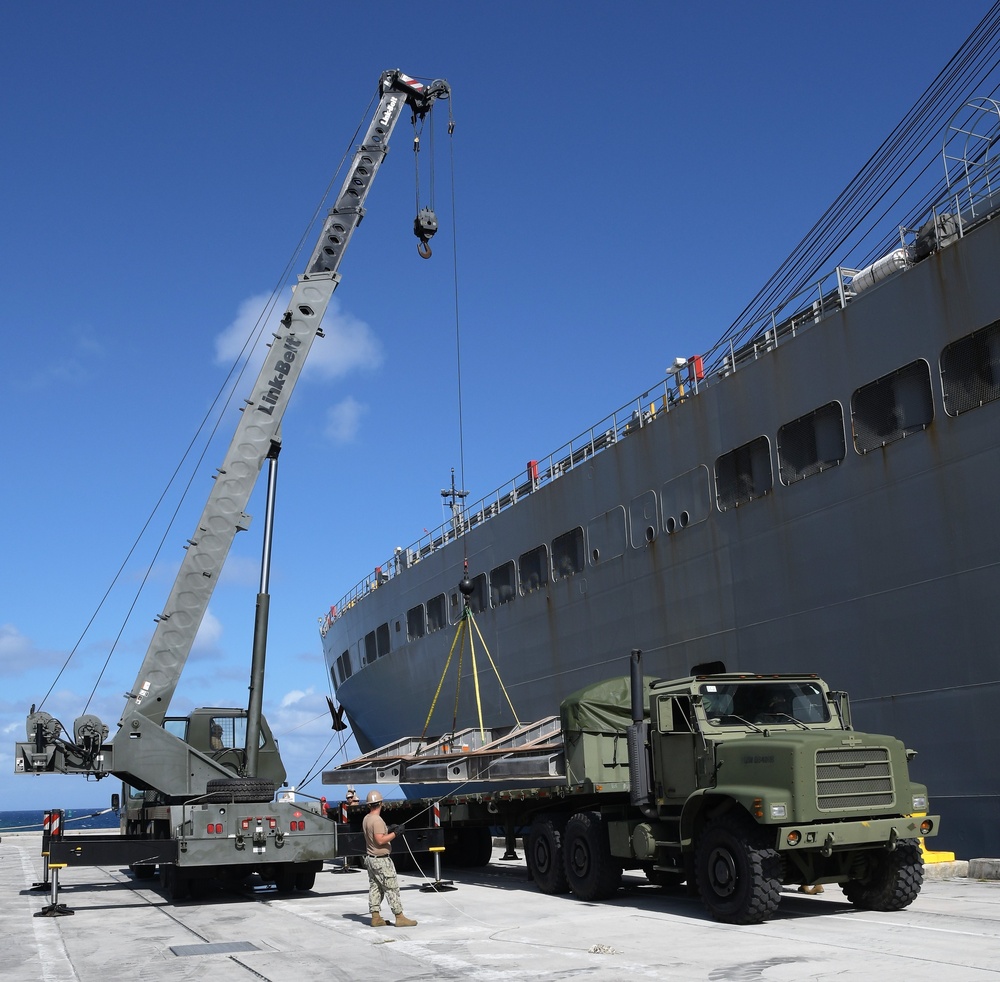 Naval Mobile Construction Battalion (NMCB) 133 det. Guam’s crane crew conduct a turnover crane lift