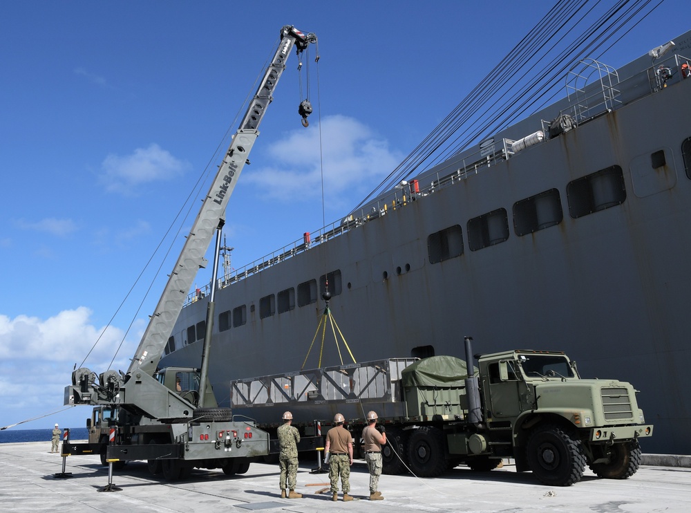 Naval Mobile Construction Battalion (NMCB) 133, Det. Guam’s crane crew conduct a turnover crane lift