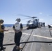 U.S. Navy Sailors conduct flight operations aboard the guided-missile destroyer USS Spruance.