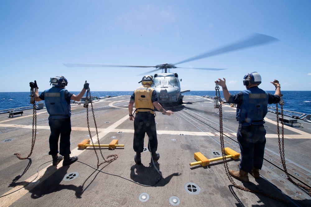 U.S. Navy Sailors conduct flight operations aboard the guided-missile destroyer USS Spruance.