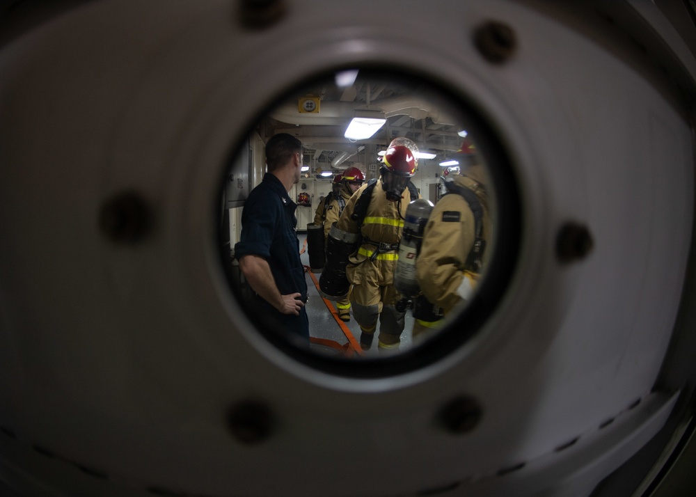 U.S. Sailors respond to a simulated fire