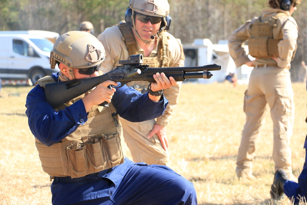 A Coast Guard special missions trainee fires the M870 Shotgun during a training exercise