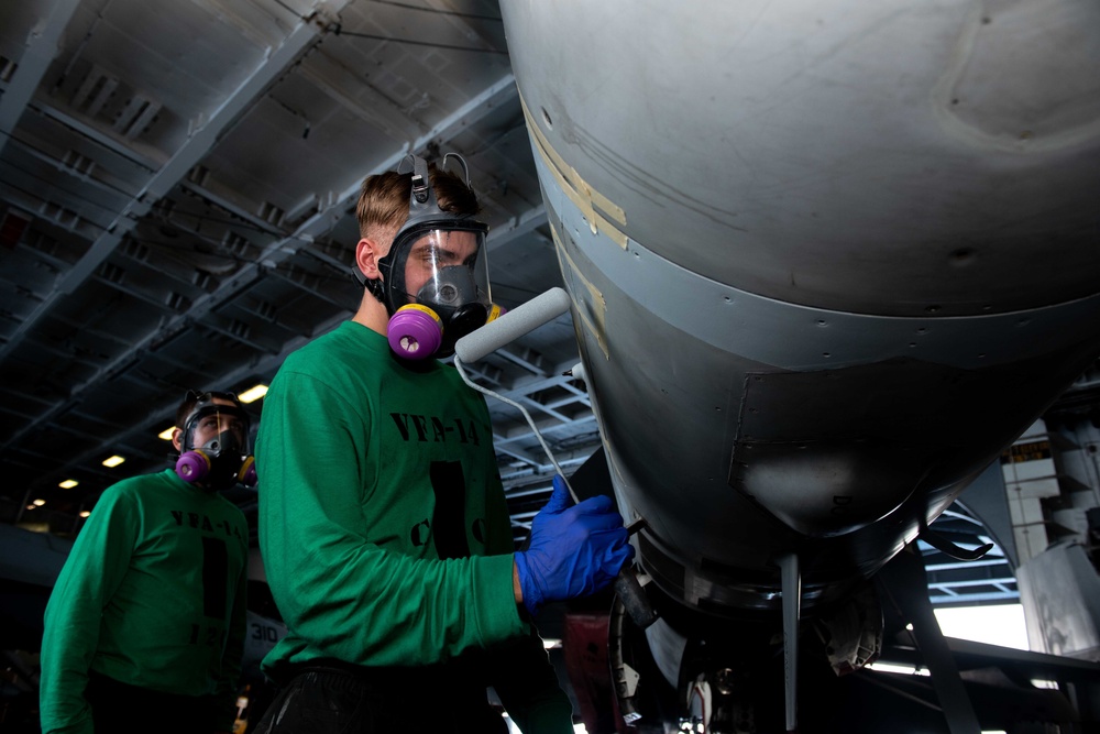 U.S. Sailor applies paint