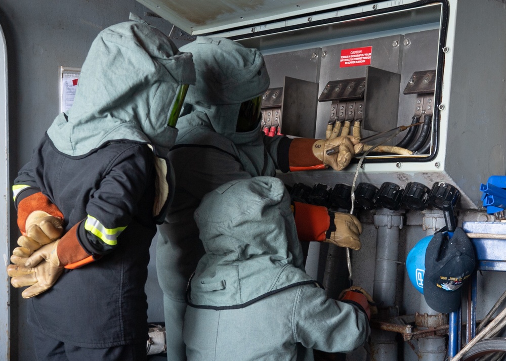 U.S. Sailors conduct an initial voltage verification