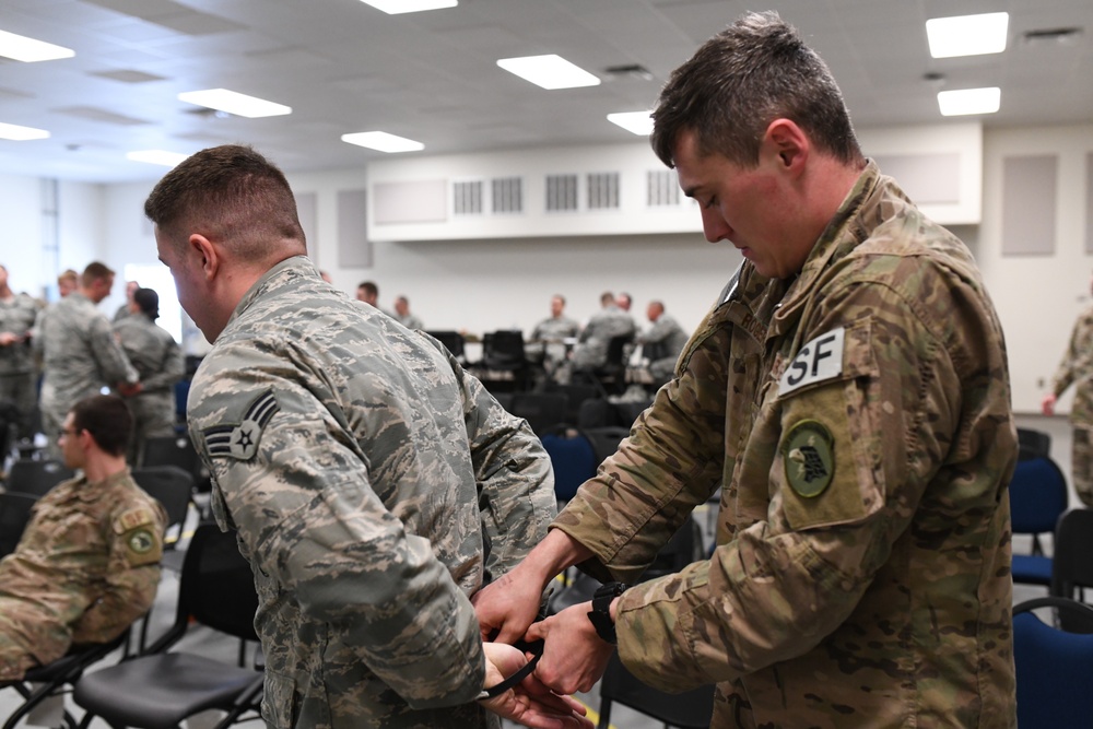 142nd Security Forces Airmen practice handcuff training during PATRIOT South