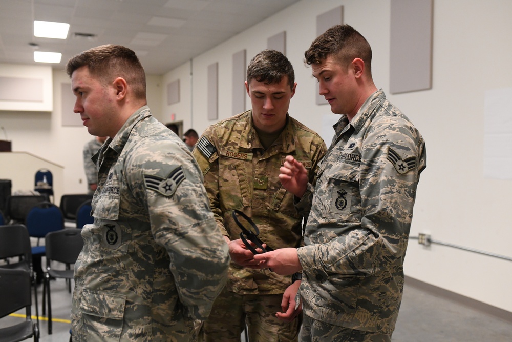 142nd Security Forces Airmen practice handcuff training during PATRIOT South