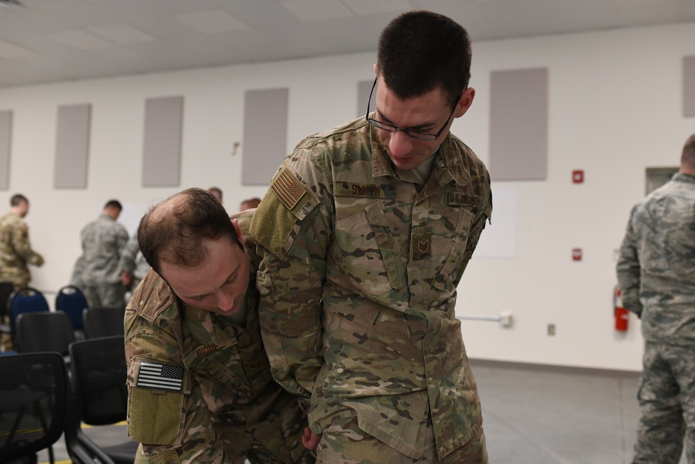 142nd Security Forces Airmen practice handcuff training during PATRIOT South