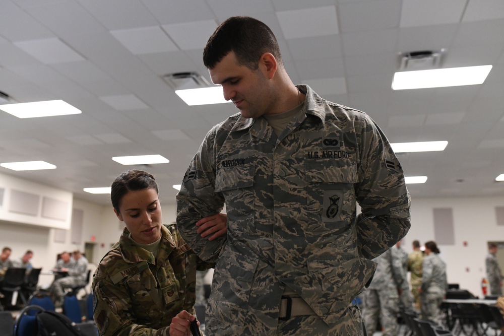 142nd Security Forces Airmen practice handcuff training during PATRIOT South