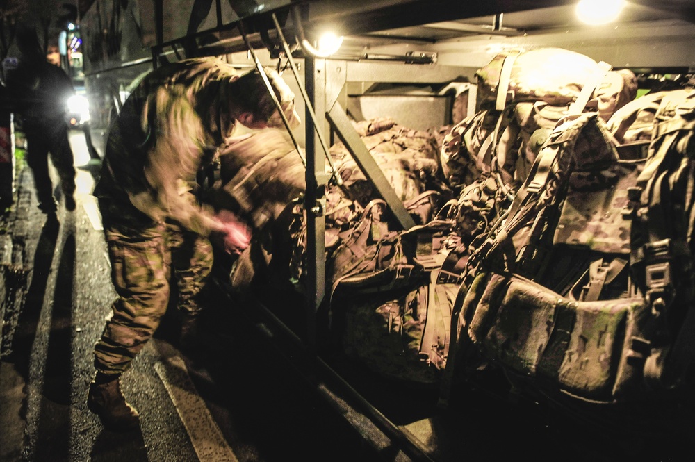 Paratrooper loads gear