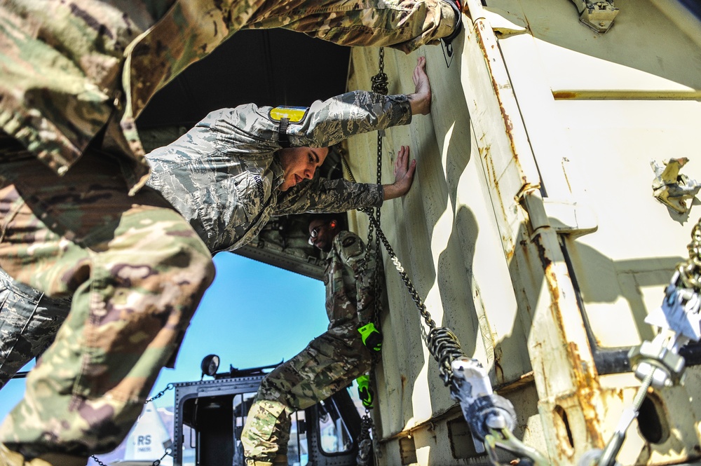 Airmen help load cargo