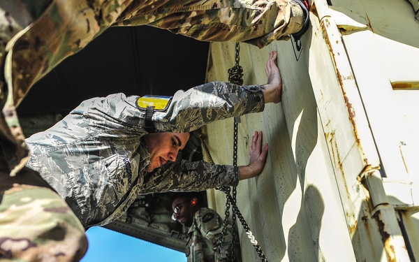 Airmen help load cargo