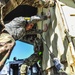 Airmen help load cargo