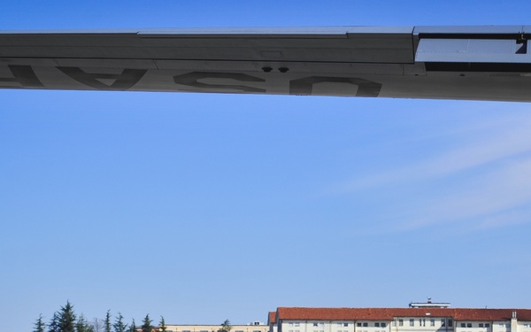 Paratroopers prepare to load C-130