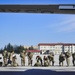 Paratroopers prepare to load C-130