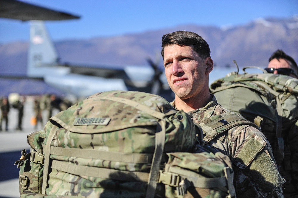 Paratrooper waits to load aircraft