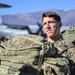 Paratrooper waits to load aircraft